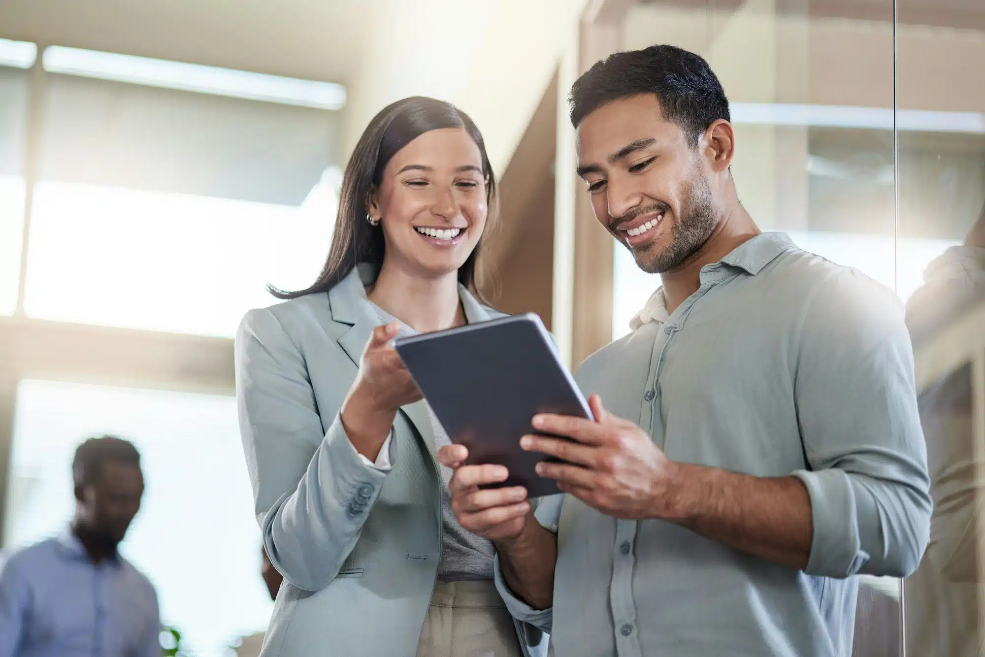 im so glad i found you shot of two coworkers talking while using a digital tablet 1 1